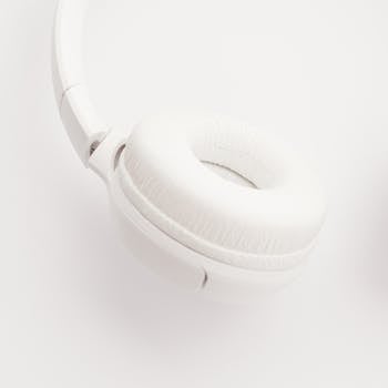 Stylish white wireless headphones on a white background, perfect for music lovers.
